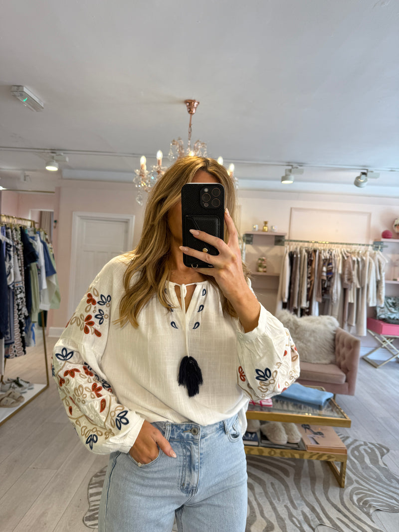 MAURA EMBROIDERED TASSLE BLOUSE